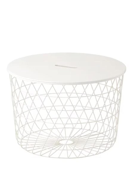 A Nest Coffee Table wire basket on top of a white surface.