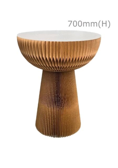 The Kraft Table Brown is a round table with a white top and a brown base featuring a honeycomb pattern, measuring 700mm in height.