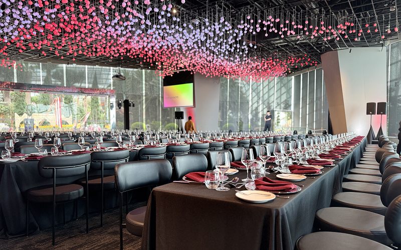 Corporate gala setup with rented dining tables and chairs.